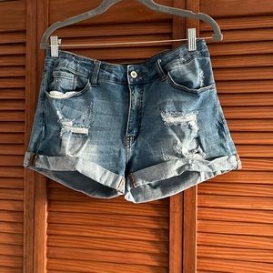 Kancan distressed medium wash cuffed hem shorts.